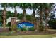 Community sign surrounded by palm trees and landscaping at 109 Old Town Way # 4, Myrtle Beach, SC 29588