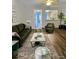 Cozy living room with hardwood floors, green furniture and a marble table at 109 Old Town Way # 4, Myrtle Beach, SC 29588