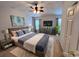 A large bedroom with a ceiling fan and a large bed at 109 Old Town Way # 4, Myrtle Beach, SC 29588