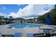 Community pool with sun loungers and a bathhouse at 109 Old Town Way # 4, Myrtle Beach, SC 29588