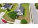 A beautiful aerial view of a single-Gathering home with a well-maintained lawn, mature trees, and a private driveway at 1108 Blue Juniper Ct., Conway, SC 29527