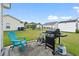 Spacious backyard featuring a well-maintained lawn and a grill for outdoor cooking at 1108 Blue Juniper Ct., Conway, SC 29527
