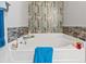 Close up of bathroom tub with updated tile at 1108 Blue Juniper Ct., Conway, SC 29527