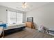 Bright bedroom featuring a ceiling fan, a window, and wood-look flooring at 1108 Blue Juniper Ct., Conway, SC 29527