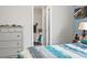 View of bedroom showing dresser and open bathroom doorway at 1108 Blue Juniper Ct., Conway, SC 29527
