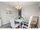 Charming dining area with round table, soft chairs, and elegant lighting at 1108 Blue Juniper Ct., Conway, SC 29527