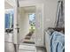 A welcoming entryway reveals a well-lit interior with a view of the charming front yard at 1108 Blue Juniper Ct., Conway, SC 29527