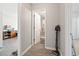 The bright hallway leads to a bathroom and bedroom with fresh paint and modern flooring at 1108 Blue Juniper Ct., Conway, SC 29527