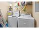 The laundry room has a washer, dryer and storage shelves at 1108 Blue Juniper Ct., Conway, SC 29527