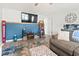 Open-concept living area featuring laminate floors and a large screen TV at 1108 Blue Juniper Ct., Conway, SC 29527