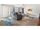 Comfortable living area, with laminate floors, a large sectional, and natural light at 1108 Blue Juniper Ct., Conway, SC 29527