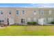 Townhome backyard with grass and a small patio, a great space for relaxing outdoors at 1123 Fairway Ln. # 1123, Conway, SC 29526