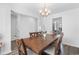 Cozy dining area features a wooden table with six chairs and a modern chandelier over the space at 1123 Fairway Ln. # 1123, Conway, SC 29526