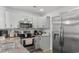 The gorgeous kitchen is equipped with stainless steel appliances, granite countertops, and stylish cabinetry at 1123 Fairway Ln. # 1123, Conway, SC 29526