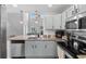 The gorgeous kitchen is equipped with stainless steel appliances, granite countertops, and stylish cabinetry at 1123 Fairway Ln. # 1123, Conway, SC 29526