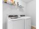 Well-lit laundry room with modern washer and dryer units at 1123 Fairway Ln. # 1123, Conway, SC 29526