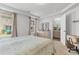 Bright main bedroom features neutral tones, a queen bed, and a dresser near windows at 1123 Fairway Ln. # 1123, Conway, SC 29526