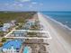 Aerial view of beautiful beachfront home with private beach access at 1184 Parker Dr., Pawleys Island, SC 29585