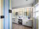 Bright bathroom with double sinks, a nautical-themed decor, and light wood floors at 1184 Parker Dr., Pawleys Island, SC 29585