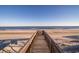 Wooden walkway providing direct access to a pristine sandy beach and ocean at 1184 Parker Dr., Pawleys Island, SC 29585