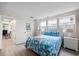 Inviting bedroom featuring coastal-themed decor, light wood floors, and ample natural light at 1184 Parker Dr., Pawleys Island, SC 29585