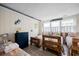 Shared bedroom with 3 twin beds, charming colorful decor, and a light, airy ambiance at 1184 Parker Dr., Pawleys Island, SC 29585