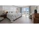 Comfortable bedroom with a king bed, ocean view, and access to a private balcony overlooking the beach at 1184 Parker Dr., Pawleys Island, SC 29585