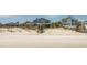 Charming beach house with stairs leading down to the sandy shore at 1184 Parker Dr., Pawleys Island, SC 29585