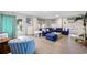 Spacious living room with comfortable seating, coastal decor, and access to an outdoor deck at 1184 Parker Dr., Pawleys Island, SC 29585