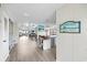 Open-concept living space with modern flooring and bright, beachy decor at 1184 Parker Dr., Pawleys Island, SC 29585