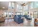 Inviting living room with soaring windows, plush sectional, and coastal decor at 1184 Parker Dr., Pawleys Island, SC 29585