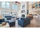 Spacious living area featuring high ceilings, fireplace, and open layout to kitchen at 1184 Parker Dr., Pawleys Island, SC 29585
