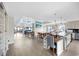 Open-concept living and dining area with a spacious kitchen, light wood floors and lots of natural light at 1184 Parker Dr., Pawleys Island, SC 29585