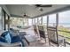 Enclosed sunroom featuring a hammock and lounge chairs with ocean views at 1184 Parker Dr., Pawleys Island, SC 29585