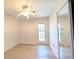 Bright bedroom with wood floors, a ceiling fan, and a glass door leading to outdoor space at 119 Brentwood Dr. # D, Murrells Inlet, SC 29576