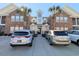 Inviting brick building exterior featuring palm trees, well-manicured grounds, and convenient parking at 119 Brentwood Dr. # D, Murrells Inlet, SC 29576