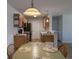 Charming kitchen with wood cabinets, black appliances, and a cozy dining area for casual meals at 119 Brentwood Dr. # D, Murrells Inlet, SC 29576
