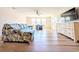 Spacious living room with wood floors, large windows, comfortable seating, and a ceiling fan at 119 Brentwood Dr. # D, Murrells Inlet, SC 29576