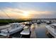 Scenic view of a marina at sunset, showcasing boats docked in the water and a tranquil atmosphere at 119 Brentwood Dr. # D, Murrells Inlet, SC 29576