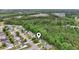 Aerial view of the home situated in a neighborhood with many mature trees at 119 Pickerel Blvd., Longs, SC 29568