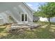 Backyard patio with views of siding, trees, and grass at 119 Pickerel Blvd., Longs, SC 29568