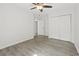 Bright bedroom with light gray wood-look flooring, a ceiling fan, and a closet at 119 Pickerel Blvd., Longs, SC 29568