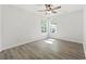 Bedroom with ample natural light from two windows and laminate flooring at 119 Pickerel Blvd., Longs, SC 29568