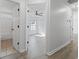 Hallway between the bedroom and bathroom with laminate flooring at 119 Pickerel Blvd., Longs, SC 29568