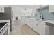 Modern kitchen with a view to the open concept living area and featuring white countertops at 119 Pickerel Blvd., Longs, SC 29568