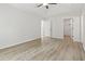 Spacious bedroom with neutral paint, white trim, walk-in closet and luxury vinyl plank flooring at 119 Pickerel Blvd., Longs, SC 29568