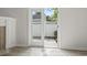 Sunlit patio door leading to private outdoor space, with neutral interior paint and luxury vinyl plank flooring at 119 Pickerel Blvd., Longs, SC 29568