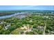 Aerial view showcasing a residential area near a waterway with a marina and stunning natural surroundings at 120 Triston Ct., Little River, SC 29566
