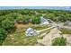 Scenic aerial view of a home on a spacious lot surrounded by lush greenery, offering a tranquil setting at 120 Triston Ct., Little River, SC 29566