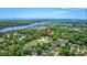 Bird's eye view of a neighborhood located by a tranquil river, showcasing lush trees and a peaceful atmosphere at 120 Triston Ct., Little River, SC 29566